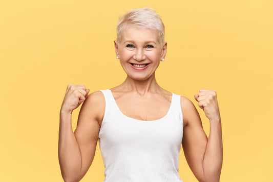 Illustration of a person with a strong and healthy immune system, depicted as glowing with vitality and surrounded by protective white blood cells.